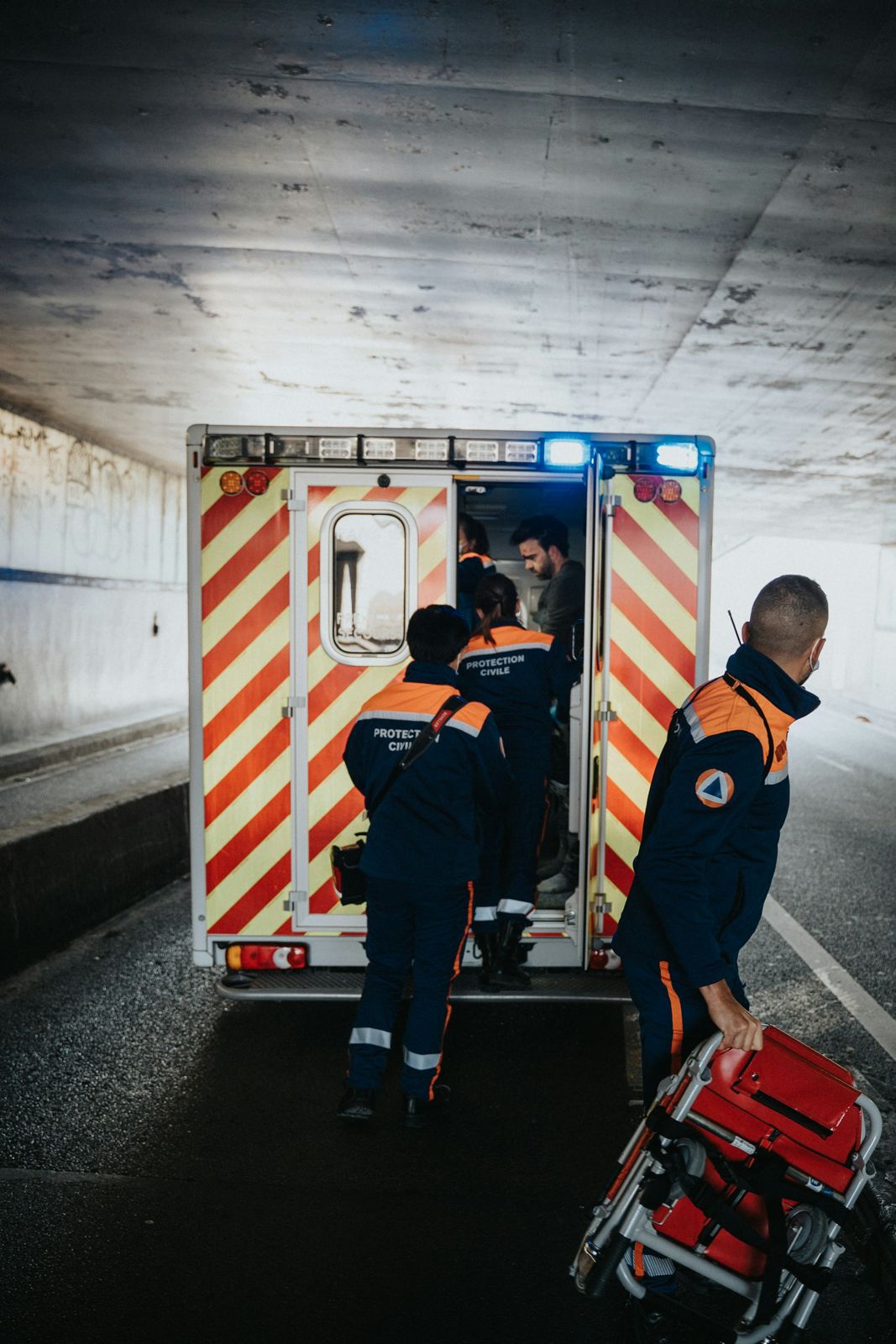 Paramedics next to an ambulance