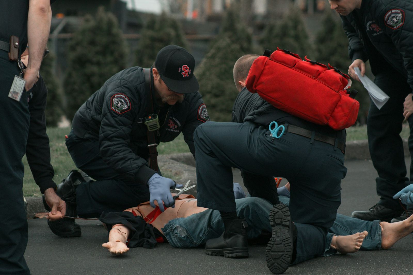 Responders assisting a person on the ground